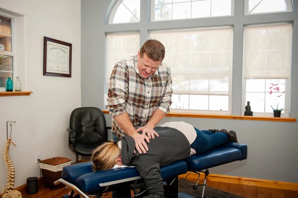 Dr. Jason Casto giving a patient a gentle adjustment in the South Lake Tahoe office